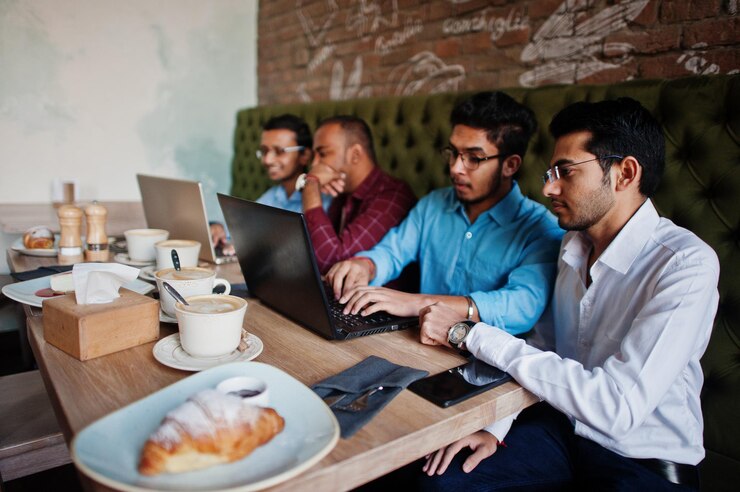 Group Four South Asian Men S Posed Business Meeting Cafe Indians Work With Laptops Together Using Various Gadgets Having Conversation 627829 5248