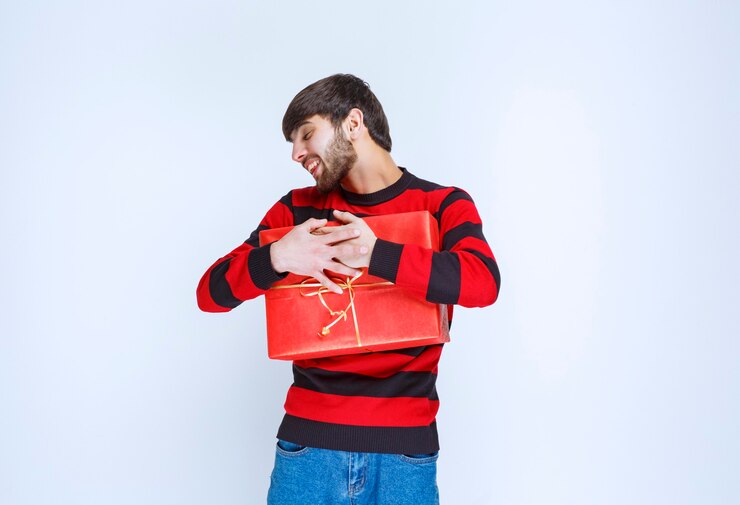 Man Red Striped Shirt Holding Red Gift Box Hugging It Tight Want Share With Anybody 144627 62726