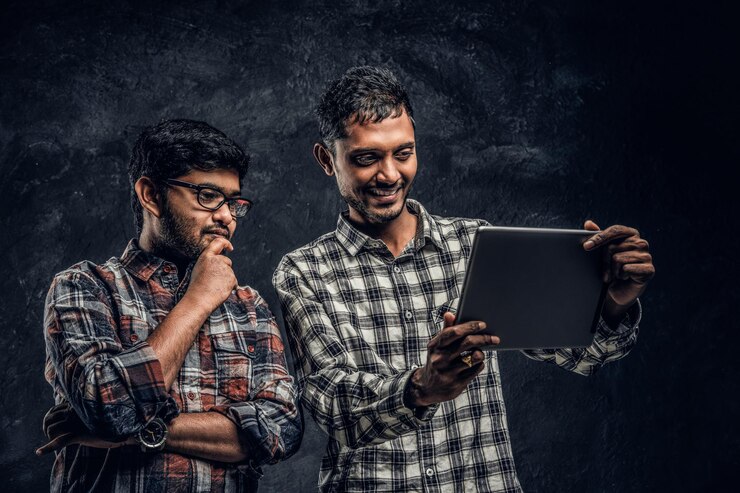 Three Happy Indian Friends Casual Clothes Stand Hug Taking Selfie Smartphone Studio Photo Against Dark Wall 613910 20950