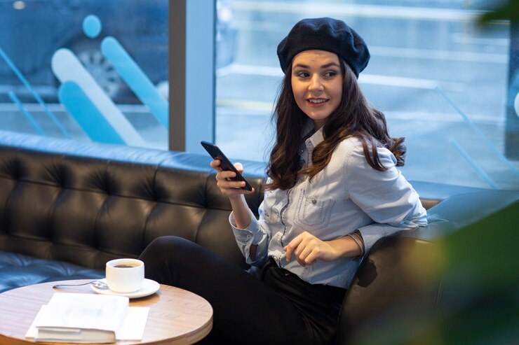 Woman Smiles While Using Smartphone 140725 7863